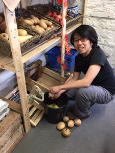 Volunteer Yien, in the shop at Elm Tree Farm