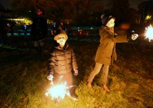 Children having fun with sparklers at Elm Tree Farm Bonfire Night party